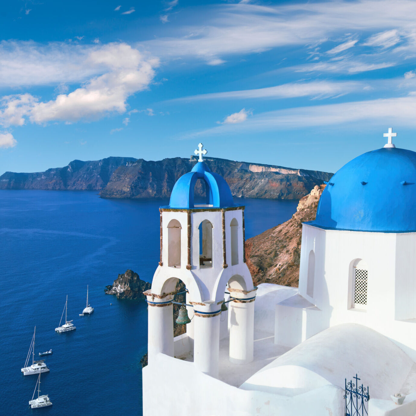 Local church with blue cupola in Oia, Santorini, panorama